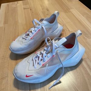White Nike athletic shoes